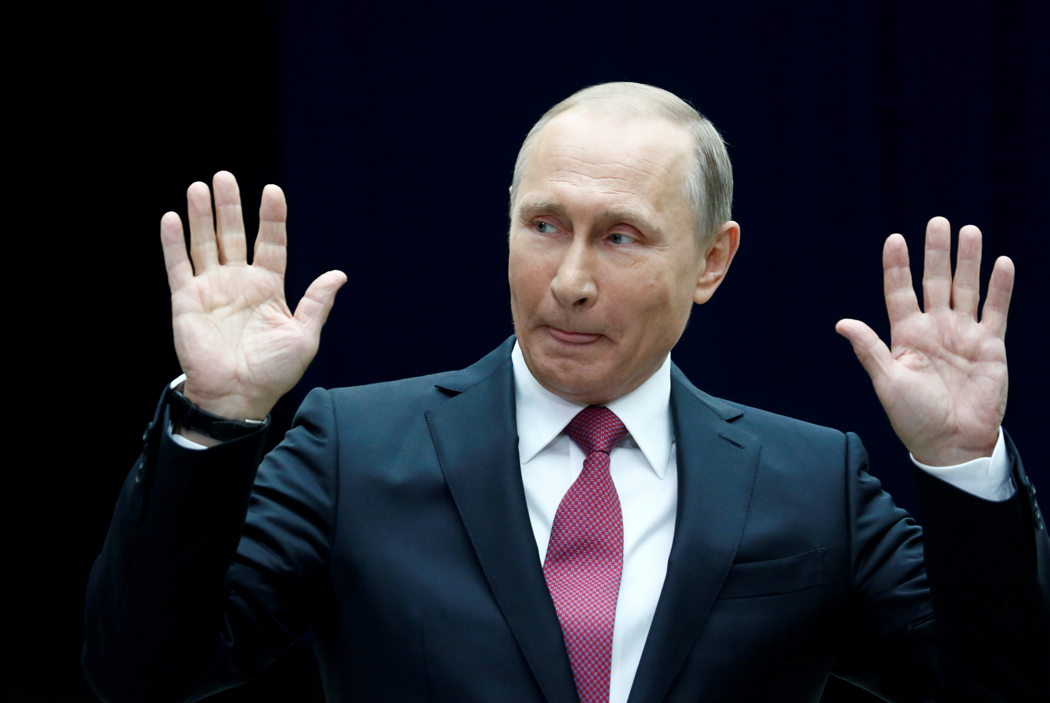 Russian President Putin gestures as he speaks to journalists following a live nationwide broadcast call-in in Moscow